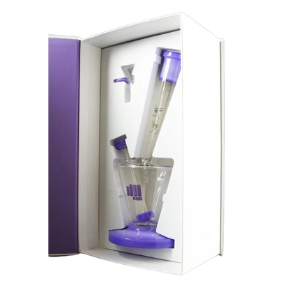Angled view of the purple Snoop Dogg Pounds-LAX Water Pipe-Purple nestled in white packaging showing its tilted clear chamber, purple base and accents.