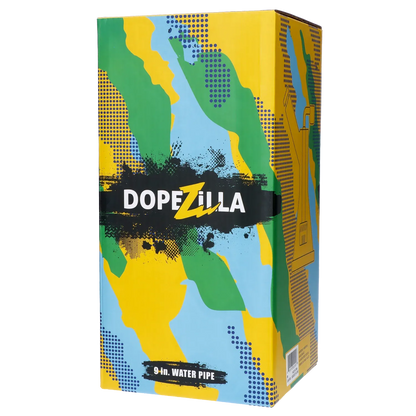 Angled front view of the colorful Dopezilla Basilisk Dab Rig - Milky Blue box with camo-like green, yellow, and blue graphics and bold DOPEZILLA logo.