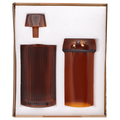 Front view of the Medusa Deco Gravity Bong - Baltic Amber, displaying its amber-colored glass tube with a detachable mouthpiece.