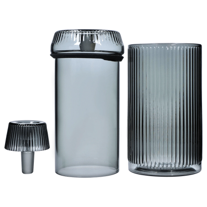 A front view of the Medusa Deco Gravity Bong - Charcoal, showing the clear glass base and charcoal attachment against a plain white background.