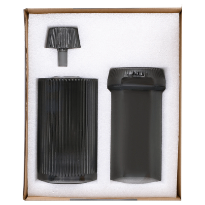 Front view of the Medusa Deco Gravity Bong - Charcoal, presented in its packaging against a white foam insert.