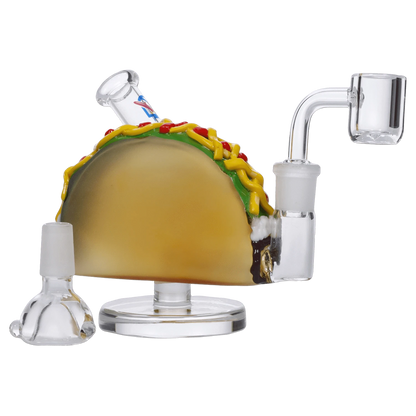 The 4-inch DHC Originals Taco Dual-Use Water Pipe is shown in a studio shot with a clear glass build and unique taco-inspired design.