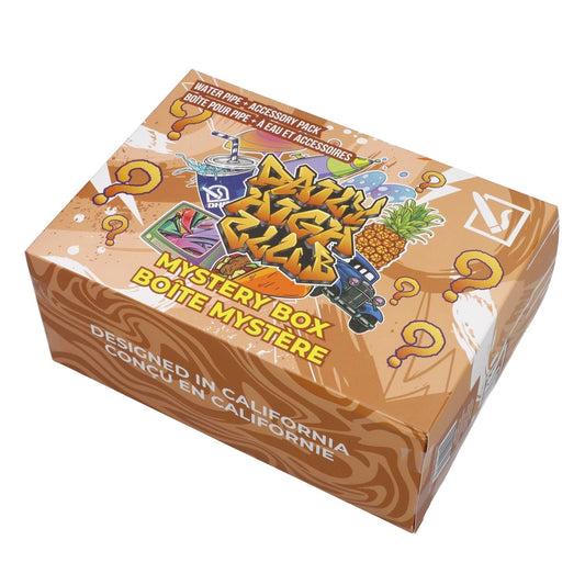 Front view of the DHC - Mystery Box - Fantasy - Peach, showcasing a peach-toned box with vibrant graphics and text in French.