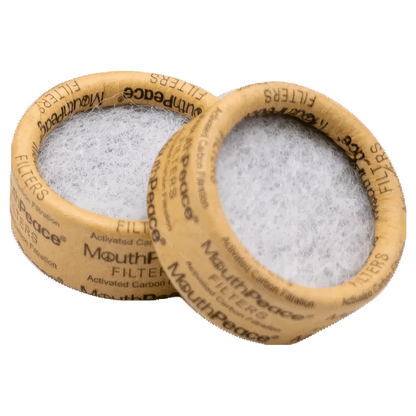 Close-up of Moose Labs Mouthpeace Filter Replacements, showcasing the circular filters stacked against a dark background.