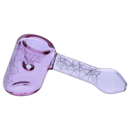 Angled close-up of the purple Famous Design Space Hammer Pipe-Purple- 5in. showing its bowl, carb hole, and geometric line pattern along the handle.