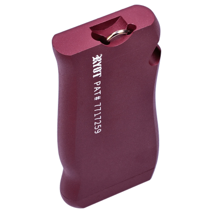 Angled close-up of the purple RYOT Slim Aluminum Dugout showing its textured aluminum body, keyring slot, and white patent number text.