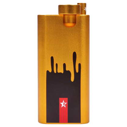 Close-up front view of the gold Famous Design Surrender Aluminum Dugout showing its textured metallic finish, black dripping graphic and red star detail.