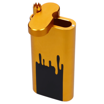 Angled close-up of the gold Famous Design Surrender Aluminum Dugout - Gold showing its hinged crown-shaped lid and black drip graphic on the rounded body