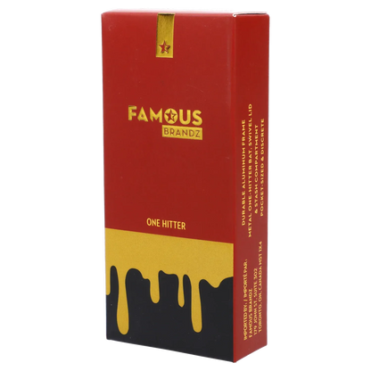 Angled view of the red and gold Famous Design Surrender Aluminum Dugout - Gold packaging with dripping gold graphic and centered logo.