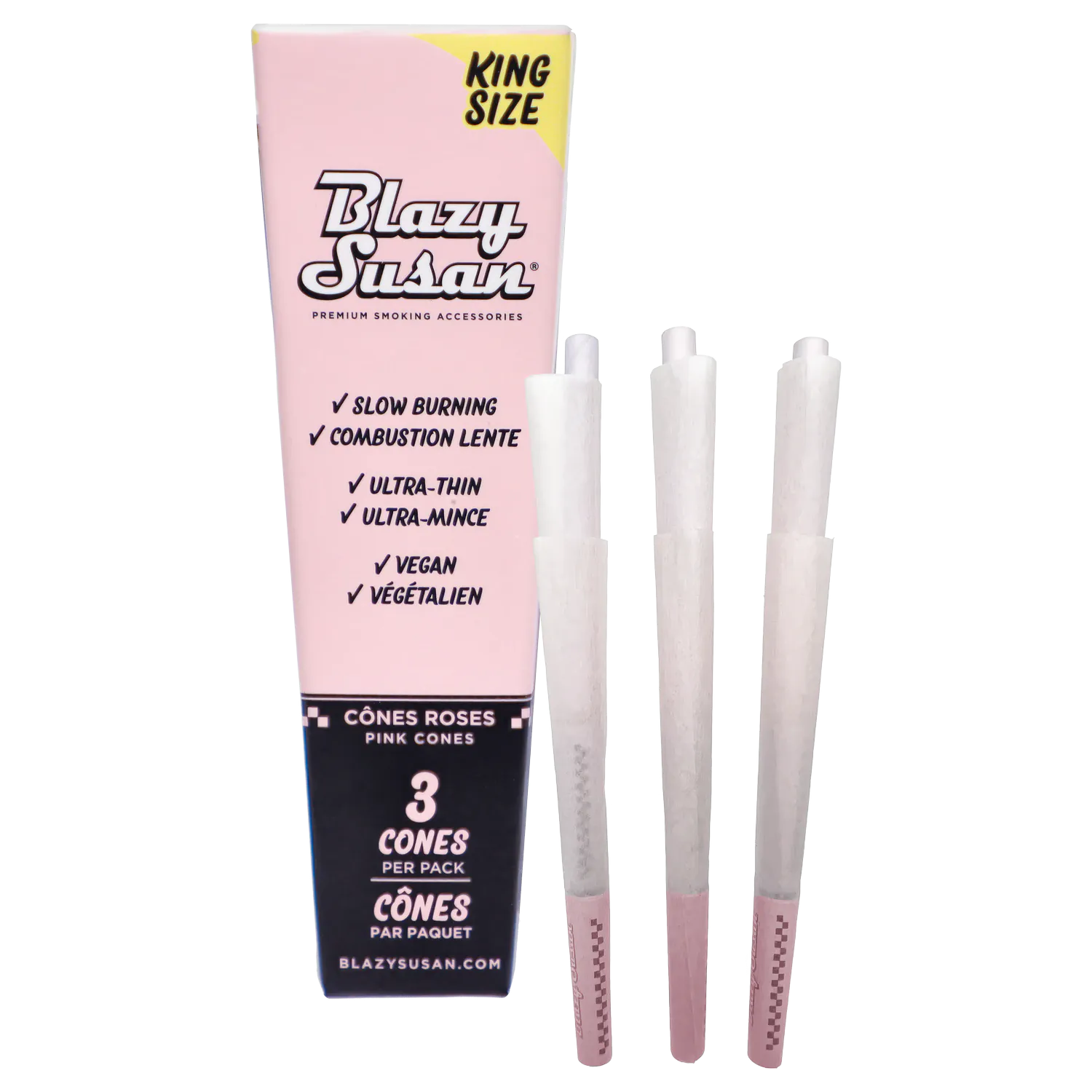 Straight-on view of a pink Blazy Susan - Pink King Size Cones - 3/pack -21/box carton with three white pre-rolled cones lined up beside it.