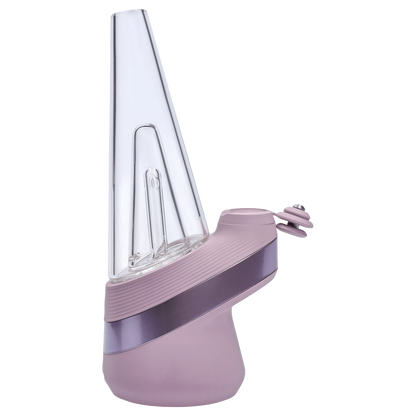 Angled close-up of the pink Puffco New Peak - Glückseligkeit showing its tall clear glass cone and textured base.