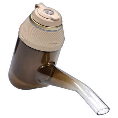 Angled close-up of the PUFFCO Proxy – Desert showing its textured tan cap and smoky translucent body and mouthpiece.