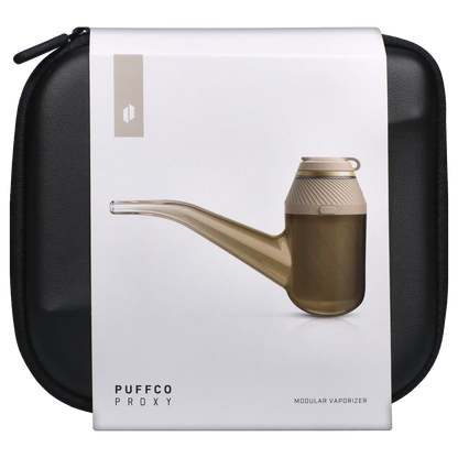 Top-down product shot of the brown Puffco Proxy – Desert modular vaporizer resting on its white packaging against a black zippered case.