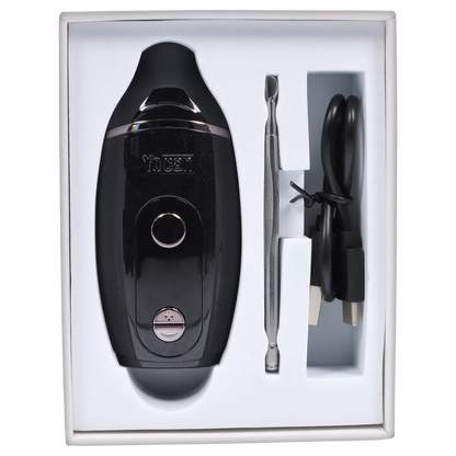 Top-down view of the black Yocan Iris Concentrate Vape Pen Kit nestled in white foam with a metal dab tool and coiled USB cable beside it.