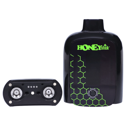 Close-up front view of the black HoneyStick Duo Variable Voltage Plus device with green honeycomb graphics and its magnetic pod shown beside it.