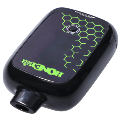 Angled close-up of the black HoneyStick Duo Variable Voltage Plus showing a glossy top panel with neon green honeycomb graphics and center button