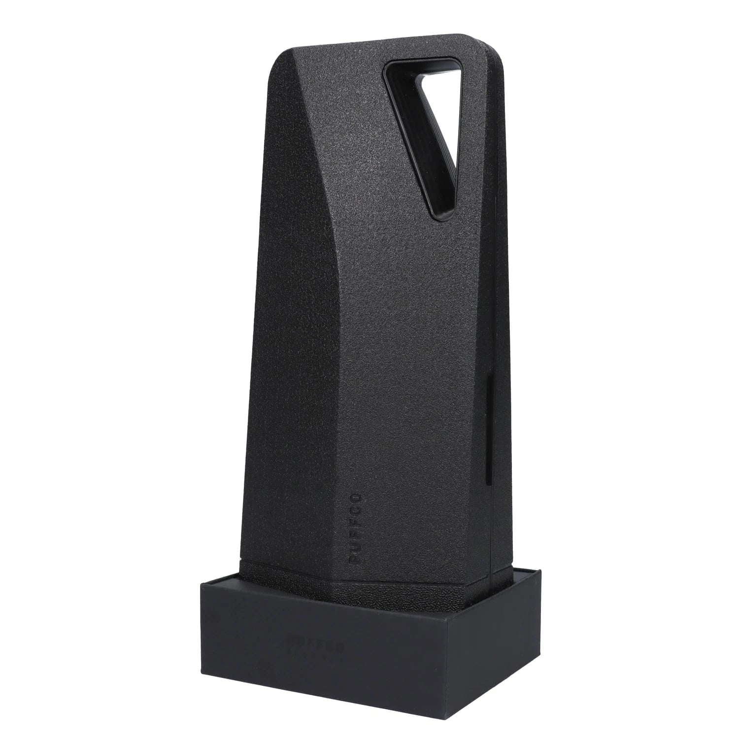 A front view of the black Puffco Peak Pro sits on a dark surface, showcasing its compact, geometric design.