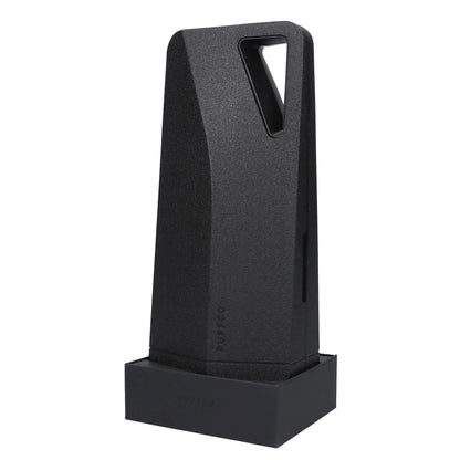 A front view of the black Puffco Peak Pro sits on a dark surface, showcasing its compact, geometric design.