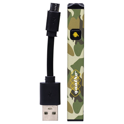 Vertical close-up of the camo HoneyStick Quatro Variable Voltage Vape Camo with its rectangular button and USB charging cable alongside.