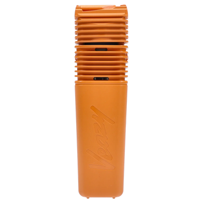 Close-up vertical shot of the Storz & Bickel Veazy Vaporizer – Inspiring Orange showing the ribbed top vents and embossed "Veazy" on the smooth orange body.