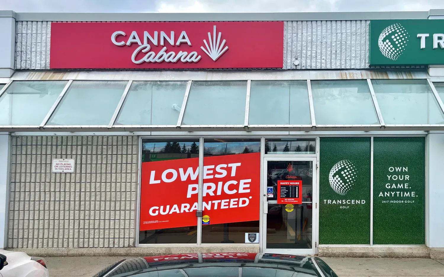 Canna Cabana storefront with red sign, large window graphic reading 