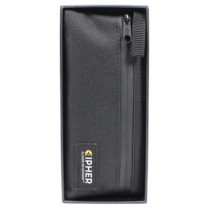 Top-down view of the black Cipher ArcSnap Electronic Dugout in its box, showing textured fabric, a zipper pull, and sewn logo tag.