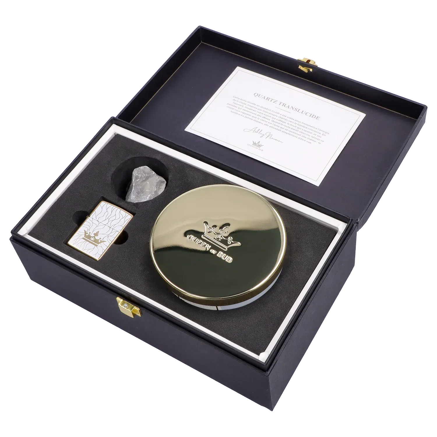 Angled top-down view of the Queen of Bud: Clarity Ritual Box – Candle, Zippo, and Crystal neatly arranged in a black foam-lined box with a gold-lidded round candle, white patterned Zippo, and translucent crystal.