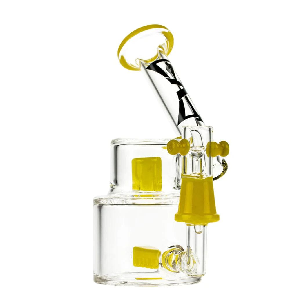A close-up, angled view of the 6-inch Evolution Morning Glory Dab Rig with a yellow dome and banger, showcasing its clear glass construction.