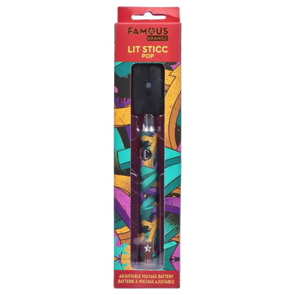 Vertical front view of the Famous Design Lit Sticc VV Battery - Mixed Design in its clear windowed packaging showing the colorful teal, purple and orange abstract patterned pen and black mouthpiece.