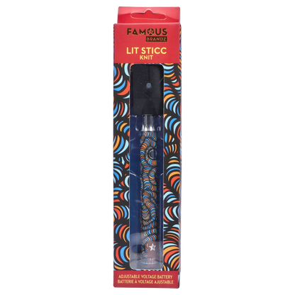 Tall front-facing shot of the Famous Design Lit Sticc VV Battery - Mixed Design in its windowed packaging showing a black top and a colorful swirled body visible through clear plastic.