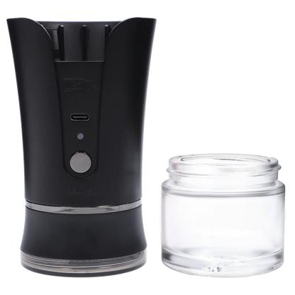 Close-up front view of the black Yocan iShred Electronic Grinder showing its curved upper housing, control button and USB-C port beside a clear glass collection jar.