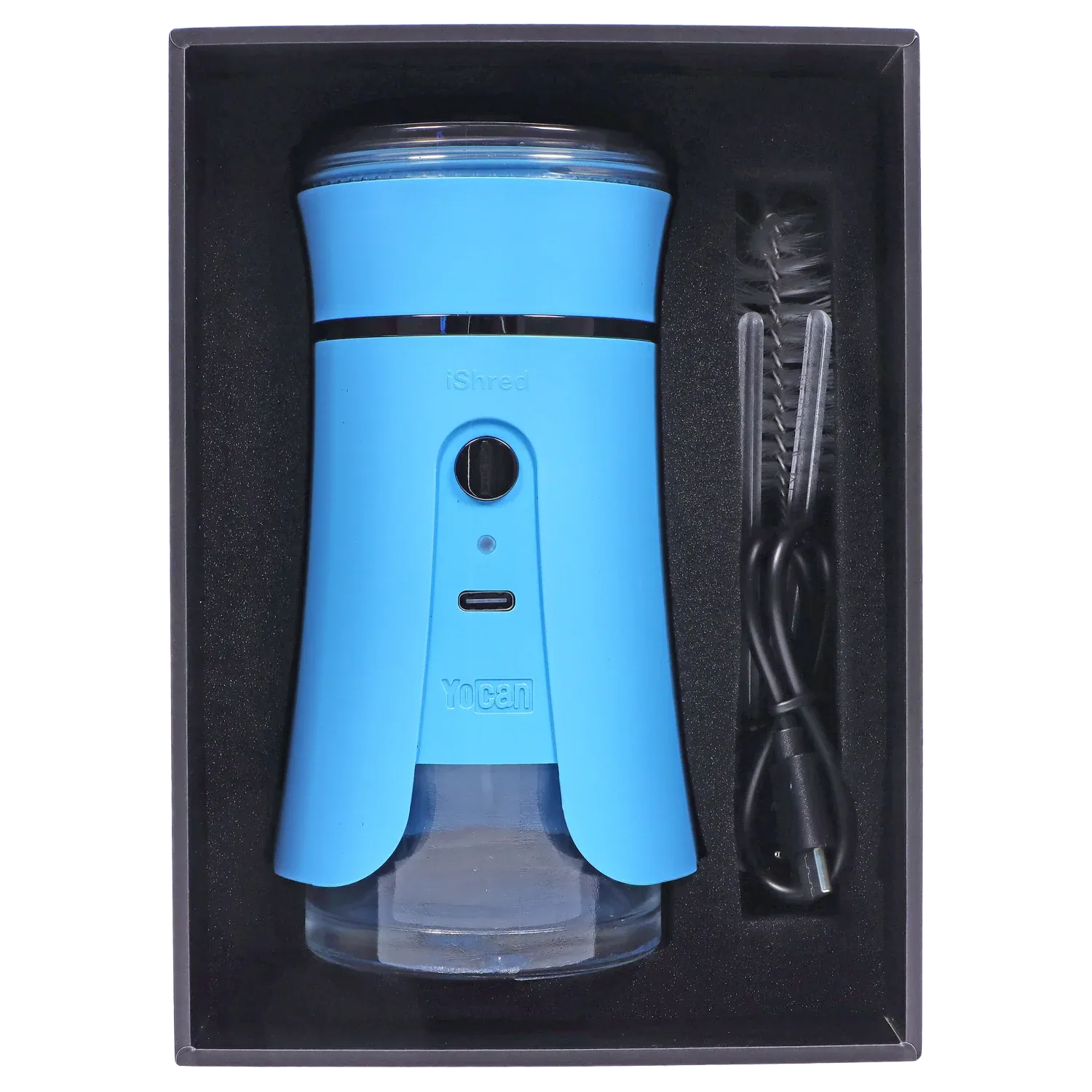 Top-down view of the blue Yocan iShred Electronic Grinder seated in its black foam tray with a USB cable and cleaning brush alongside