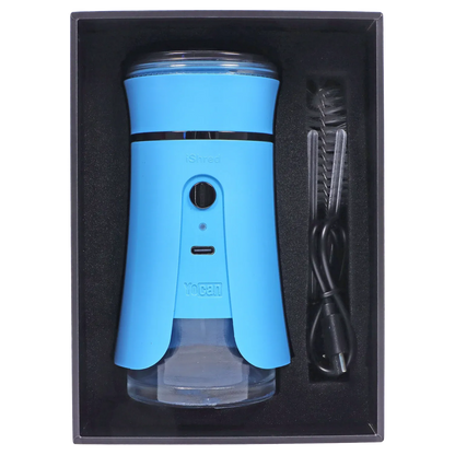 Top-down view of the blue Yocan iShred Electronic Grinder seated in its black foam tray with a USB cable and cleaning brush alongside