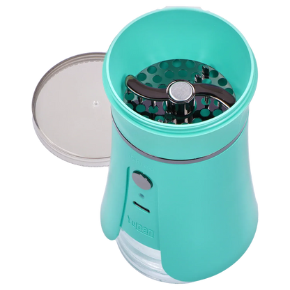 Top-down view of the open Yocan iShred Electronic Grinder – Green showing its teal chamber, silver lid beside it, and black three-prong shredding blade.