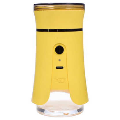 Front-facing close-up of the yellow Yocan iShred Electronic Grinder showing its round top, central button and USB-C port.