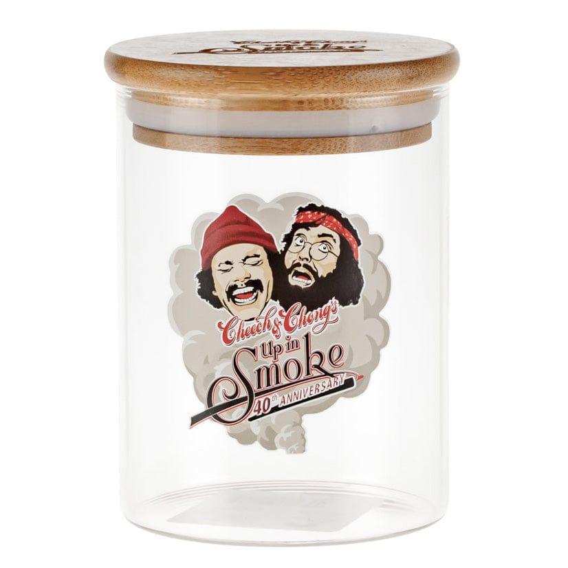Clear front view of the C&C Heads Stash Jar - Mittel showing a bamboo lid and a printed vintage "Up in Smoke" comedic portrait on the glass.