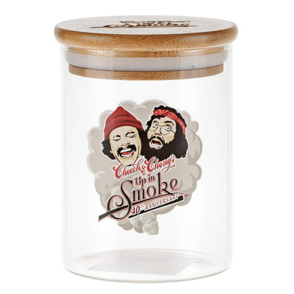 Clear front view of the C&C Heads Stash Jar - Mittel showing a bamboo lid and a printed vintage "Up in Smoke" comedic portrait on the glass.