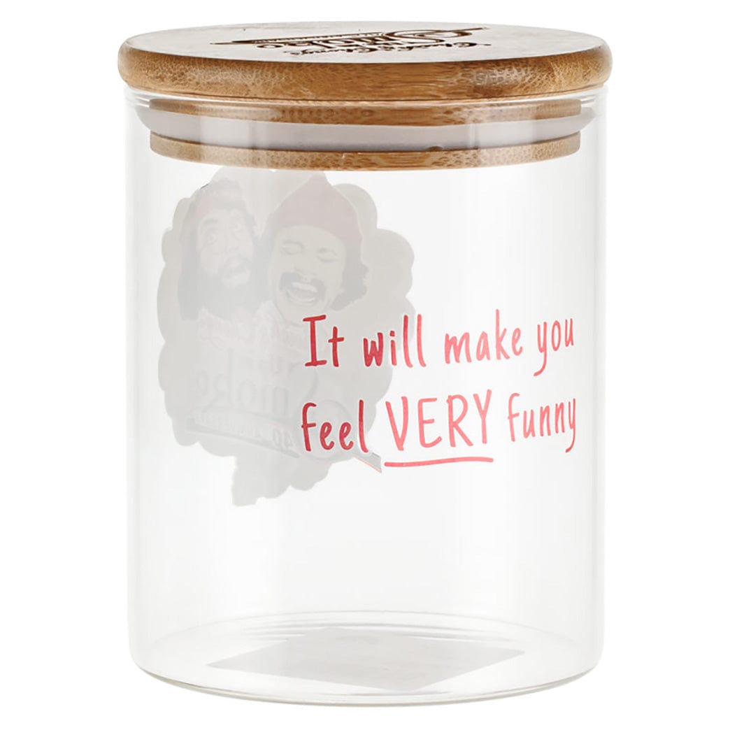 Front view of a clear glass jar with a bamboo lid featuring red lettering that reads "It will make you feel VERY funny," C&C Köpfe Stash Glas - Groß