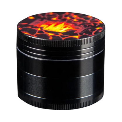 Close-up angled view of the Hellboy Inferno 3-Stufen Grinder - 50mm showing its black metal body and a fiery red-orange lava pattern on the top lid.