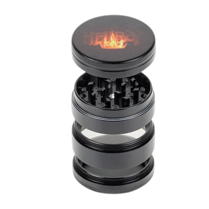 Angled view of a black Hellboy Logo 3-Stufen Grinder with its textured lid lifted to reveal sharp interior teeth and mesh screen.