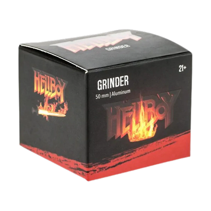 Angled three-quarter view of the Hellboy Logo 3-Stufen Grinder black box with flaming logo and "GRINDER 50 mm | Aluminum" text.