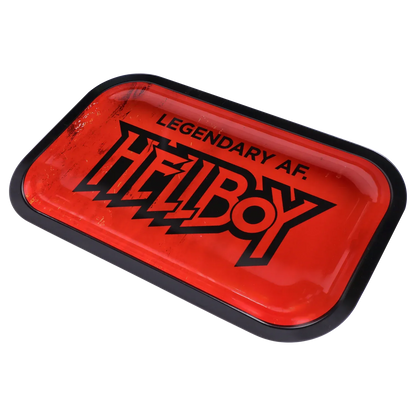 Angled close-up of the red Hell Boy Legendäres Rolling Tray - Mittel with bold black logo and scuffed glossy surface inside a black rim