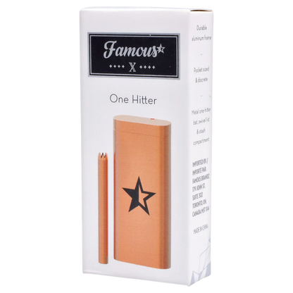 Angled front view of the Famous X Aluminum Dugout - Rose Gold showing the rose-gold metal case and matching bat against a white box.