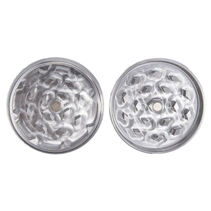 A top-down view of the Famous X - Crystal 2 pc Grinder in silver, showcasing its multi-tiered, crystalline grinding teeth.