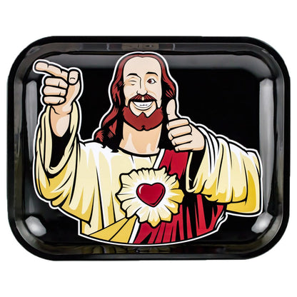 Top-down view of the JSB Buddy Christ Rolling Tray - Groß showing a winking, cartoon Jesus giving a thumbs-up and pointing on a glossy black background.
