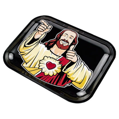 Angled top view of the JSB Buddy Christ Rolling Tray - Groß showing a glossy black tray with a cartoon Jesus giving thumbs-up and a red heart emblem.