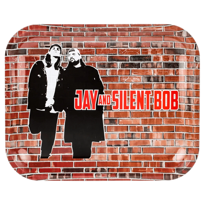 Top-down view of the JSB Jay & Silent Bob Wand Rolling Tray - Groß showing stencil-style black silhouettes of Jay and Silent Bob against a textured red brick wall background with bold red text.