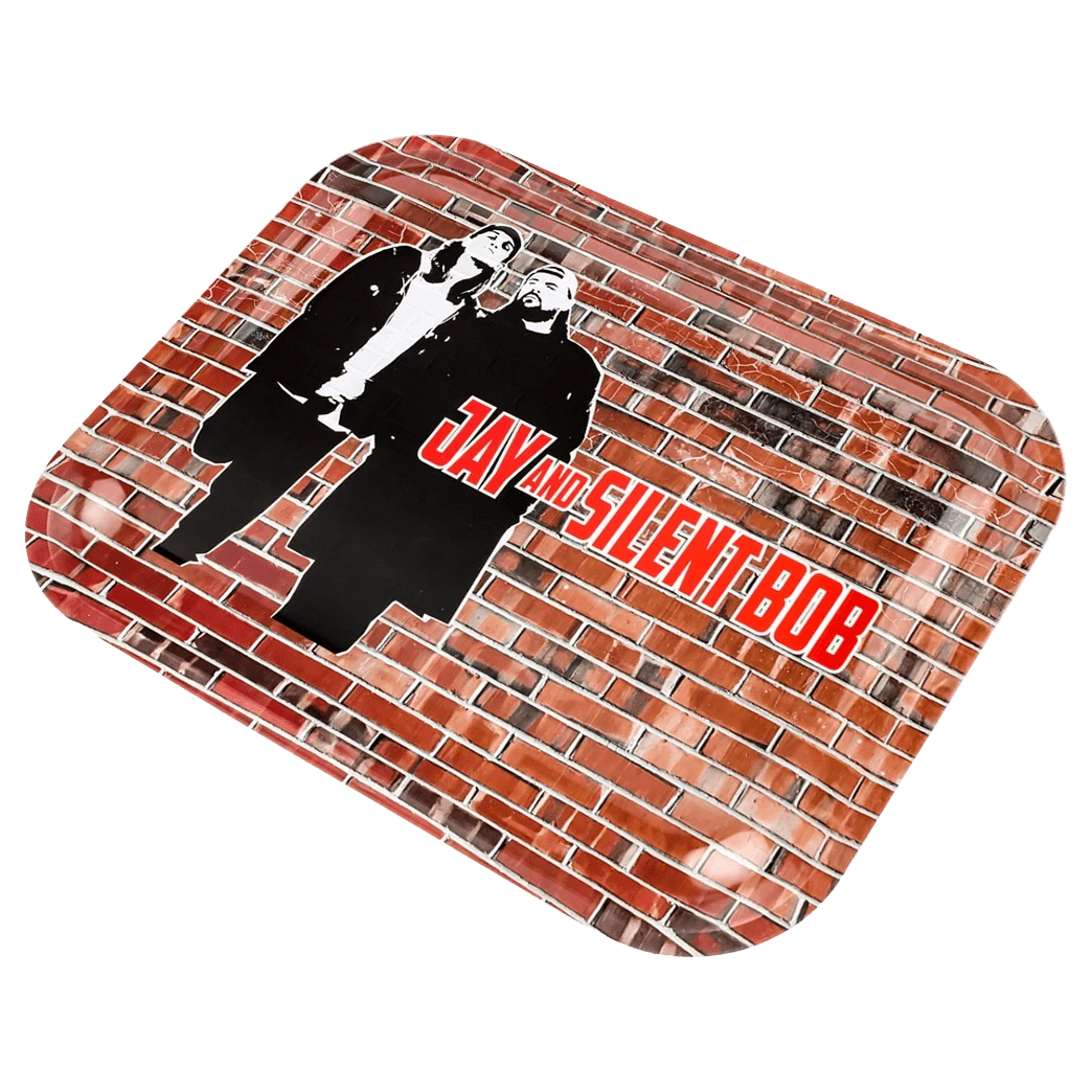 Angled view of the JSB Jay & Silent Bob Wand Rolling Tray showing a brick-wall print with black-and-white silhouettes of Jay and Silent Bob and red logo text.