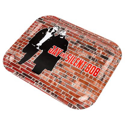 Angled view of the JSB Jay & Silent Bob Wand Rolling Tray showing a brick-wall print with black-and-white silhouettes of Jay and Silent Bob and red logo text.