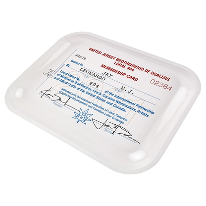 Angled top-down view of the white JSB Signature Tray-Large featuring a printed vintage membership card design with red and blue text.